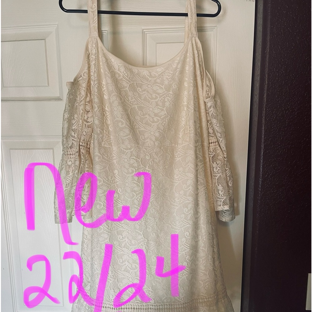 Beautiful lace cold shoulder mid length dress. New with tags 22/24